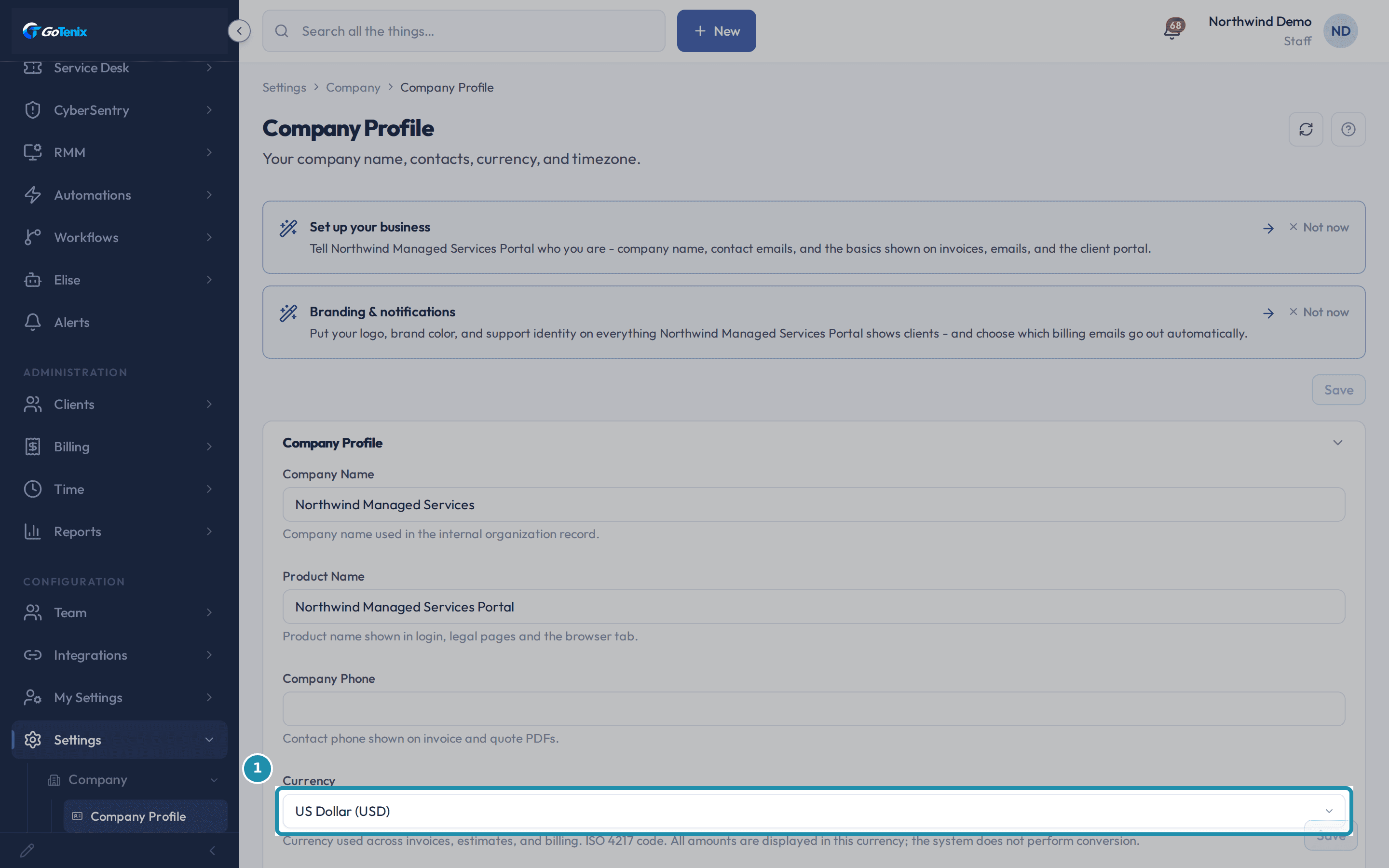 The Currency field on Company Profile set to US Dollar (USD), boxed, with its description below saying amounts display in this currency and the system does not perform conversion.